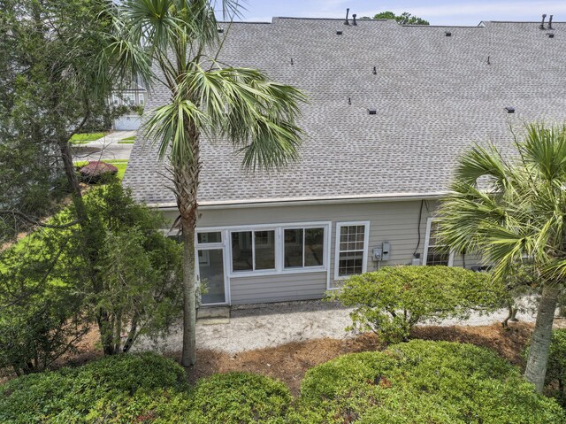 132 Fresh Meadow Ln, Mount Pleasant, SC 29466 - rear view of house with a shingled roof and a patio area