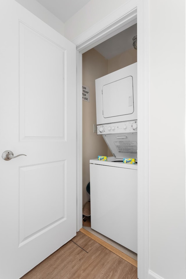 5802 Palmetto Dr Unit B-521/519, Isle Of Palms, SC 29451 - laundry room with estacked washer and dryer and light wood-type flooring