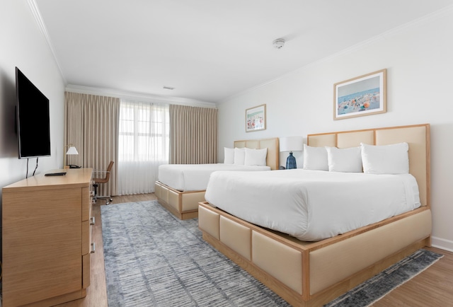 5802 Palmetto Dr Unit B-521/519, Isle Of Palms, SC 29451 - bedroom with crown molding and light wood-type flooring