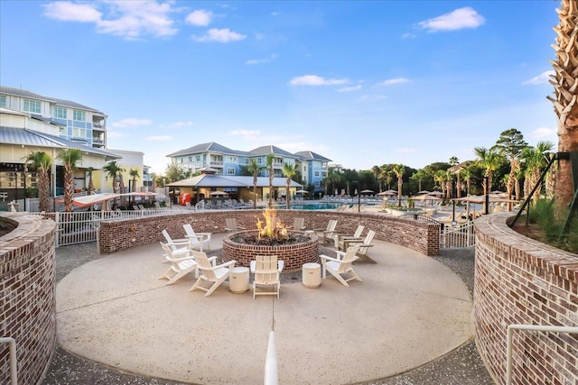 5802 Palmetto Dr Unit B-521/519, Isle Of Palms, SC 29451 - view of patio / terrace with a community pool, an outdoor fire pit, and fence
