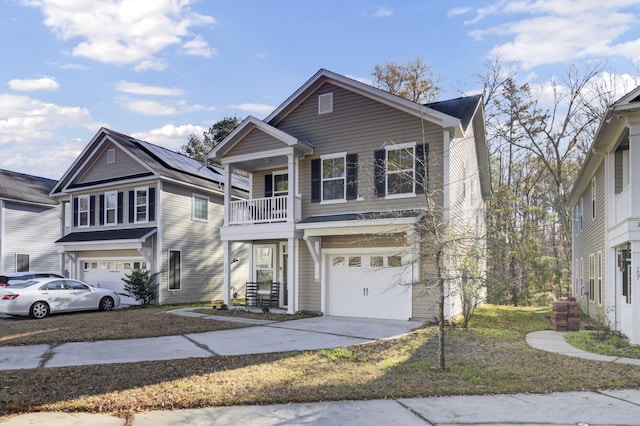 view of front property with a garage and a balcony