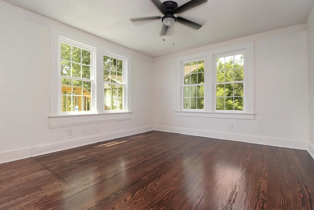 unfurnished room featuring dark hardwood / wood-style floors, a wealth of natural light, and ceiling fan