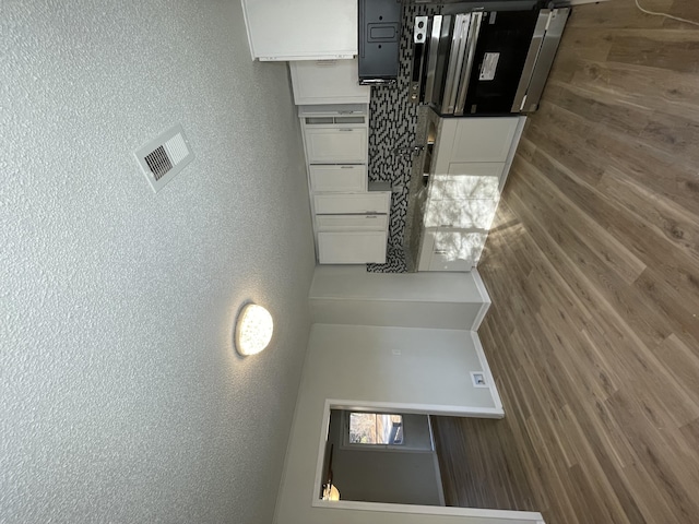 kitchen featuring white cabinets