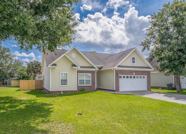 7812 Spring Creek Rd, North Charleston, SC 29418 - view of front of home with driveway, a garage, brick siding, and roof with shingles