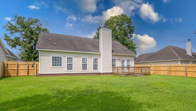 7812 Spring Creek Rd, North Charleston, SC 29418 - back of house with a fenced backyard, a chimney, and a wooden deck