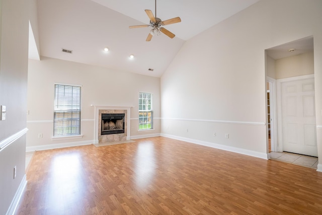 7812 Spring Creek Rd, North Charleston, SC 29418 - unfurnished living room with healthy amount of natural light, high vaulted ceiling, a ceiling fan, and light wood-style floors