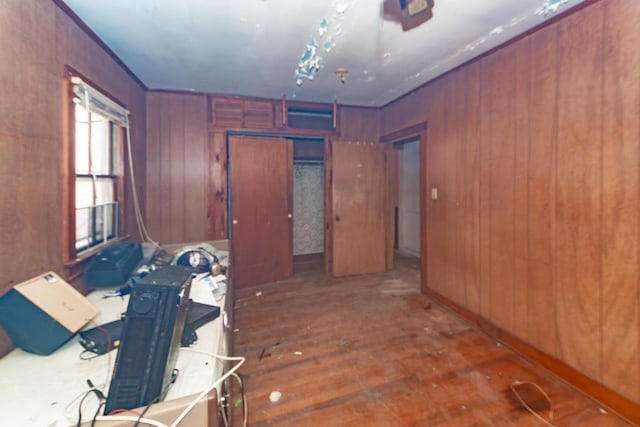 interior space with wooden walls and dark wood-style flooring