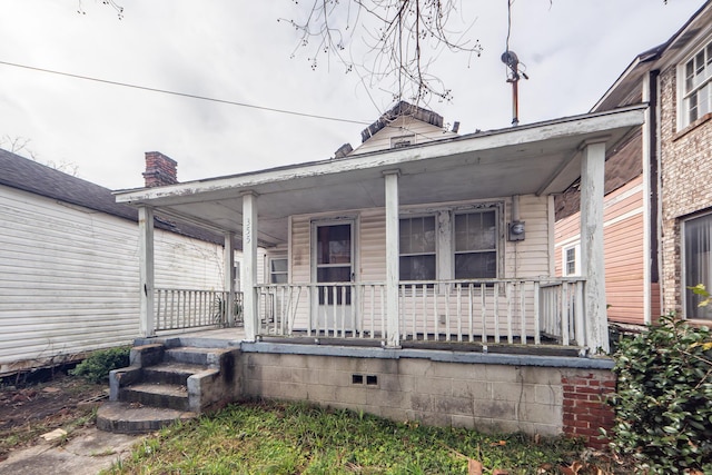 entrance to property with covered porch