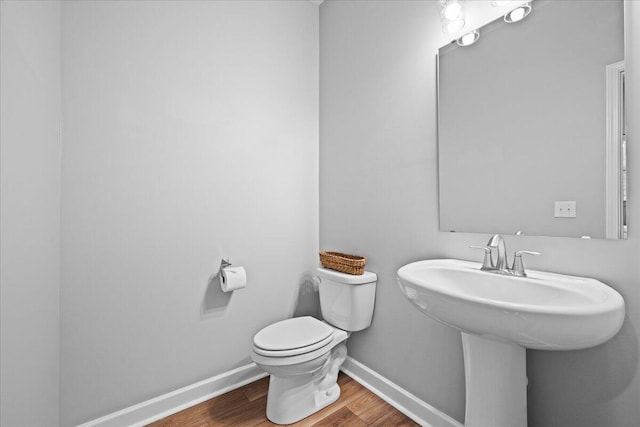 217 Lucca Dr, Summerville, SC 29486 - half bathroom featuring baseboards, a sink, toilet, and wood finished floors
