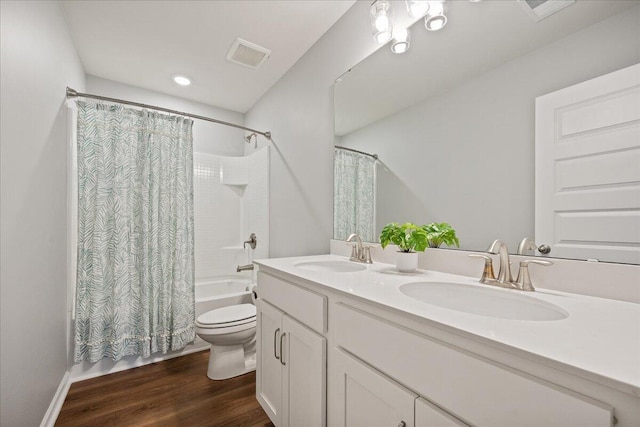 217 Lucca Dr, Summerville, SC 29486 - full bathroom with shower / bathtub combination with curtain, visible vents, a sink, and wood finished floors