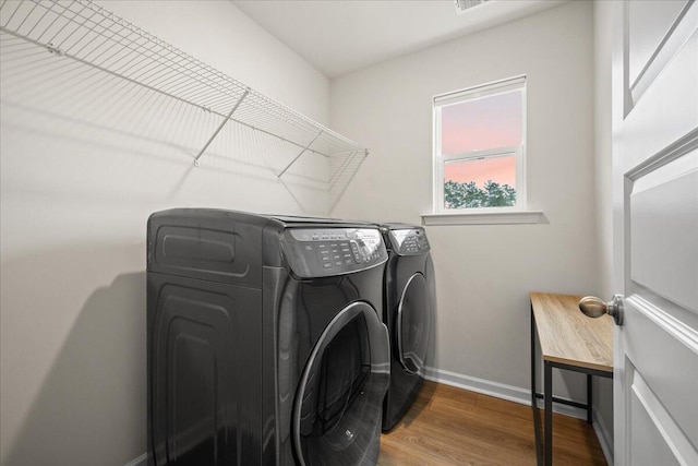 217 Lucca Dr, Summerville, SC 29486 - clothes washing area with laundry area, separate washer and dryer, wood finished floors, and baseboards