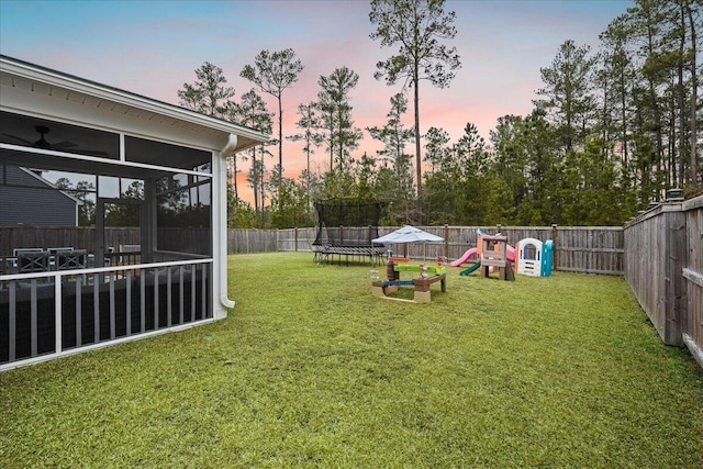 217 Lucca Dr, Summerville, SC 29486 - view of yard with a trampoline, a sunroom, a playground, and a fenced backyard