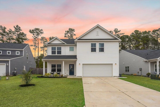 217 Lucca Dr, Summerville, SC 29486 - traditional-style house featuring covered porch, a lawn, board and batten siding, a garage, and driveway