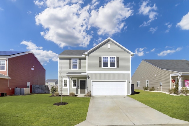traditional home with a garage, driveway, a front yard, and fence