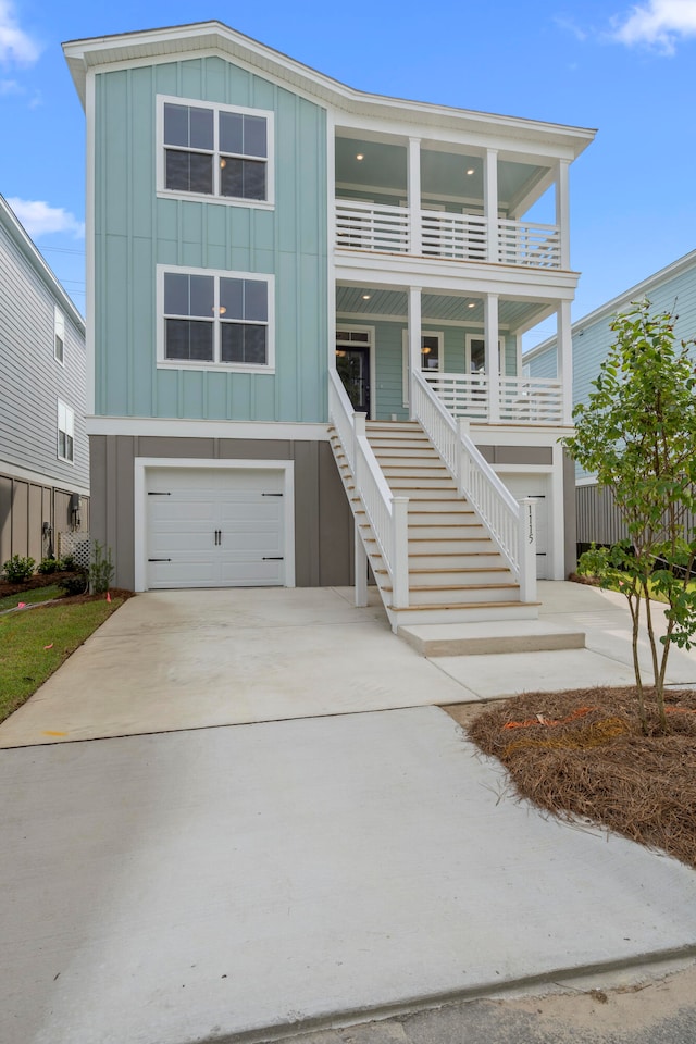 view of front of home featuring a balcony and a garage