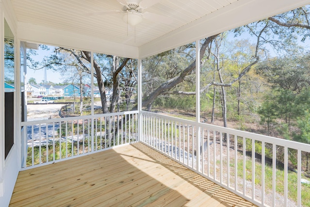 wooden deck featuring ceiling fan