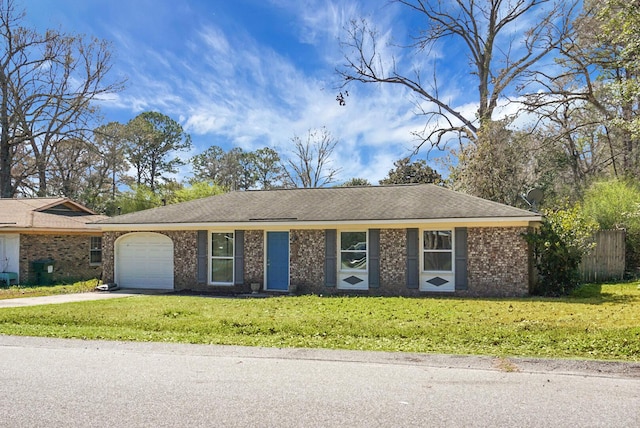 ranch-style house featuring brick siding, an attached garage, concrete driveway, and a front lawn