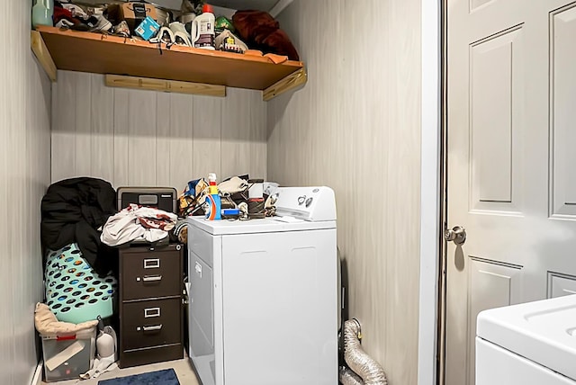 clothes washing area featuring laundry area and separate washer and dryer