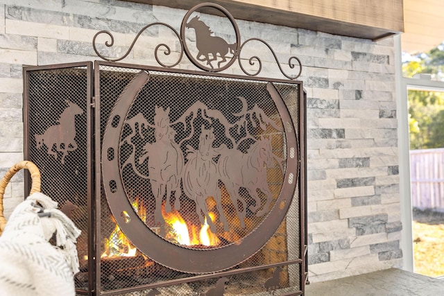 details with a lit fireplace