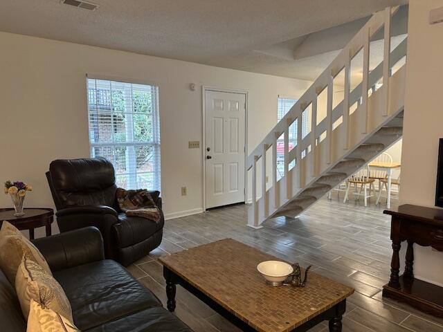 living room with a textured ceiling