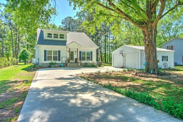bungalow-style home featuring a detached garage, a front lawn, an outdoor structure, and a shingled roof