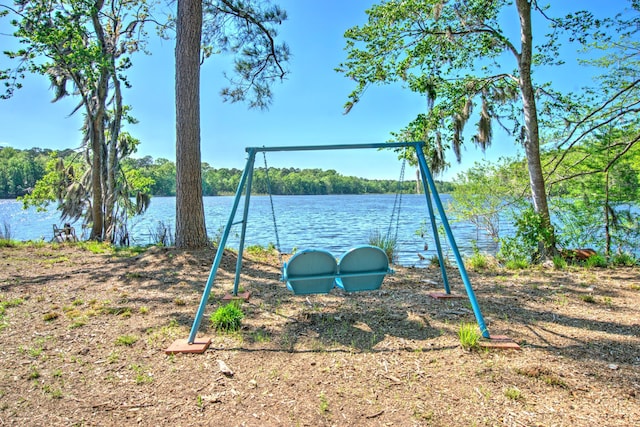 view of jungle gym featuring a water view