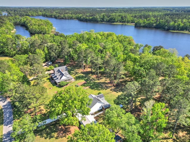 aerial view featuring a water view and a view of trees