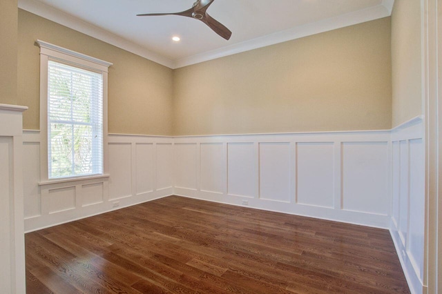 spare room featuring ornamental molding, ceiling fan, and dark hardwood / wood-style floors