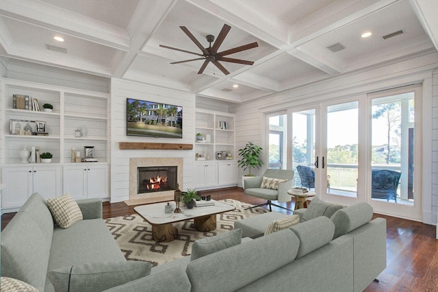 living room with dark hardwood / wood-style floors, beam ceiling, and coffered ceiling