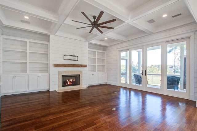 unfurnished living room featuring beamed ceiling, coffered ceiling, dark hardwood / wood-style floors, and ceiling fan