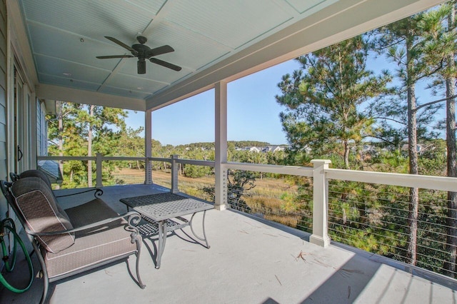 sunroom / solarium with ceiling fan