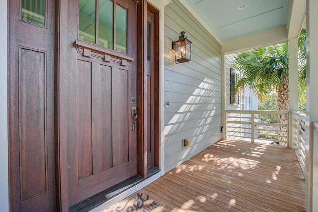 entrance to property featuring covered porch