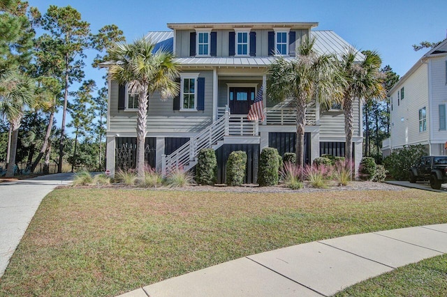 beach home with a front lawn