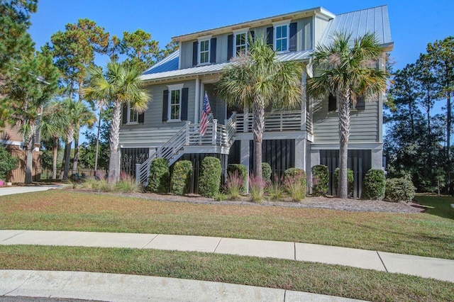 coastal home with a front lawn