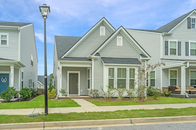 803 Lachicotte Creek Dr, Charleston, SC 29492 - view of front facade with roof with shingles and a front lawn