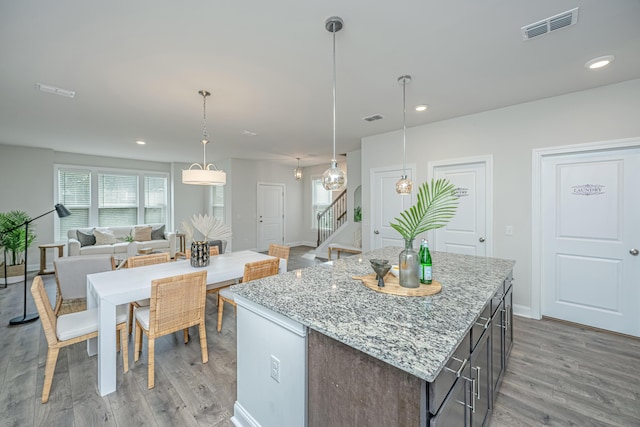 803 Lachicotte Creek Dr, Charleston, SC 29492 - kitchen with a kitchen island, open floor plan, visible vents, and light wood-type flooring