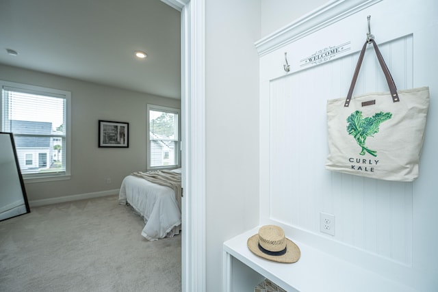 mudroom with light carpet