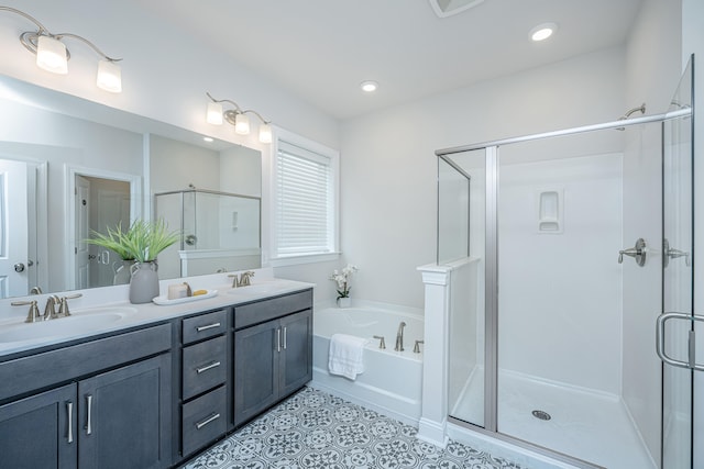 bathroom featuring vanity, tile patterned floors, and shower with separate bathtub