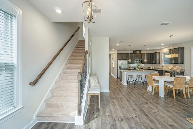 stairs with wood-type flooring