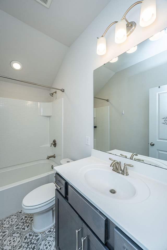 full bathroom with tile patterned floors, toilet, vaulted ceiling, shower / tub combination, and vanity