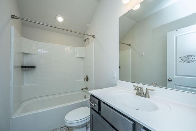 full bathroom featuring vanity, lofted ceiling, toilet, and washtub / shower combination