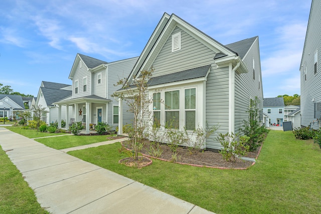 view of front of house featuring a porch and a front lawn