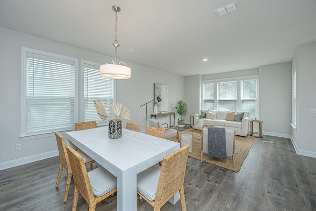 dining area featuring dark hardwood / wood-style flooring