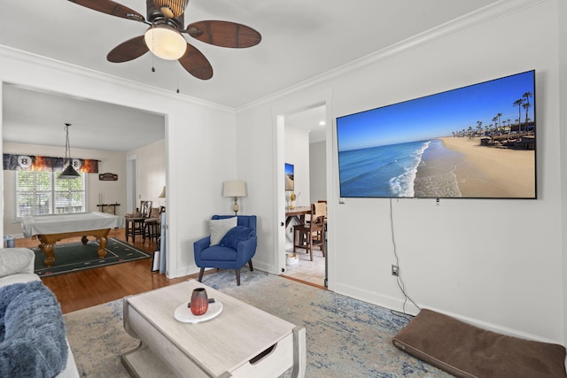 living room with crown molding, ceiling fan, billiards, and wood finished floors