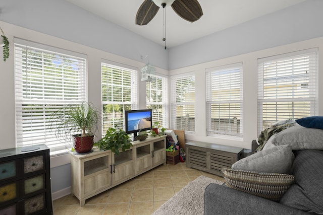 sunroom with tile patterned floors and baseboards
