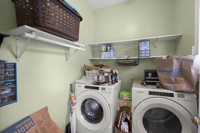 clothes washing area with separate washer and dryer and laundry area