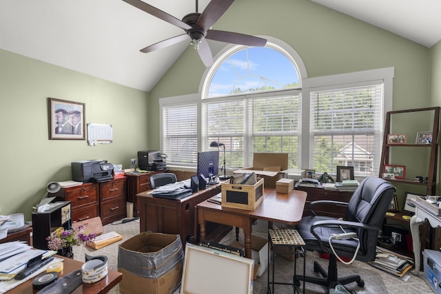 office featuring high vaulted ceiling, plenty of natural light, a ceiling fan, and light colored carpet