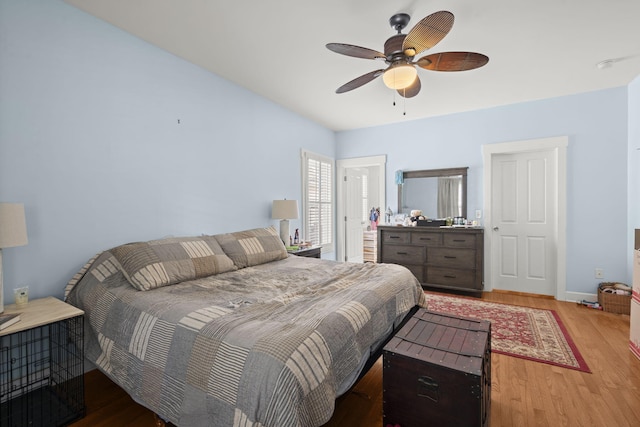 bedroom with ceiling fan and wood finished floors