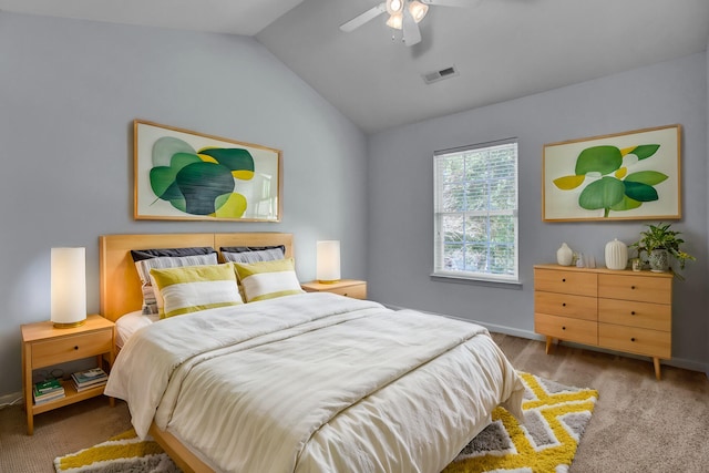 bedroom with ceiling fan, light carpet, and vaulted ceiling