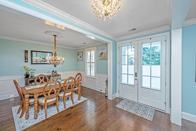 2997 Sturbridge Rd, Mount Pleasant, SC 29466 - dining room featuring a chandelier, ornamental molding, dark wood finished floors, a wainscoted wall, and french doors
